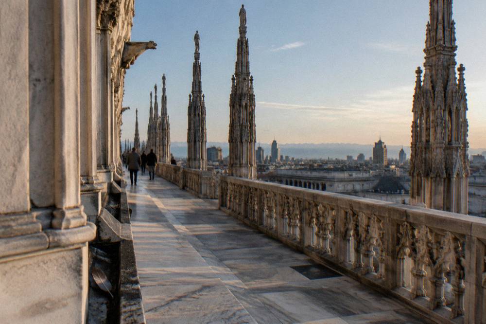 Marble rooftop terraces of Milan Cathedral with views over the city skyline