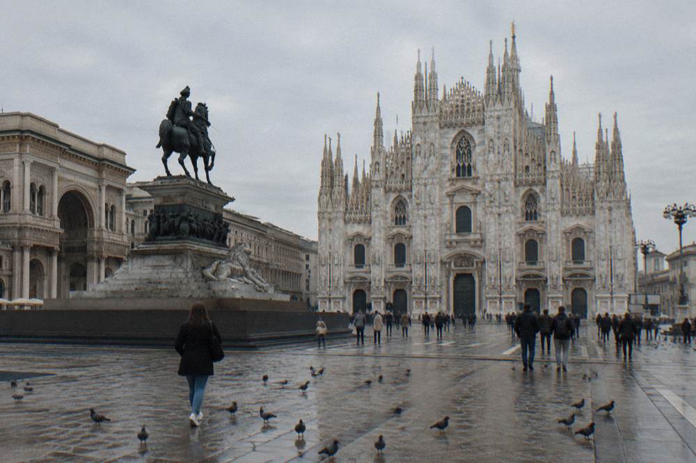 Piazza del Duomo with the cathedral facade and the equestrian statue in daylight