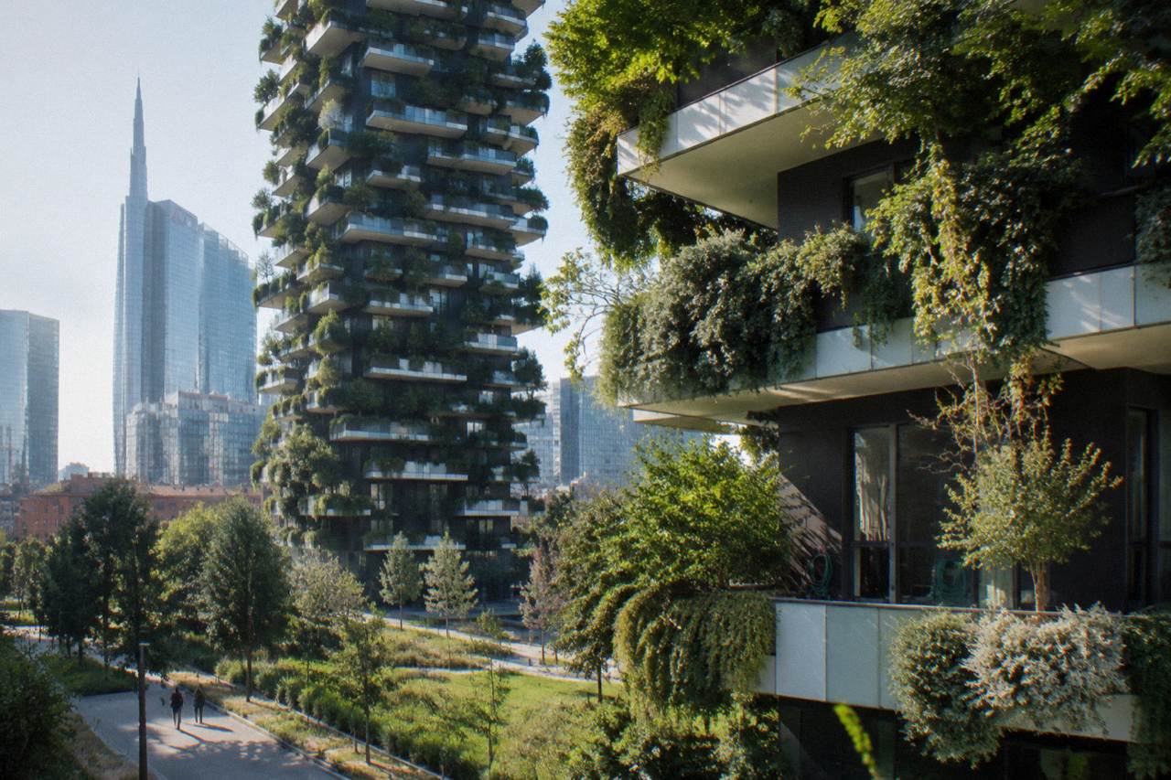 The planted terraces of the Bosco Verticale towers rising above the Porta Nuova skyline in Milan