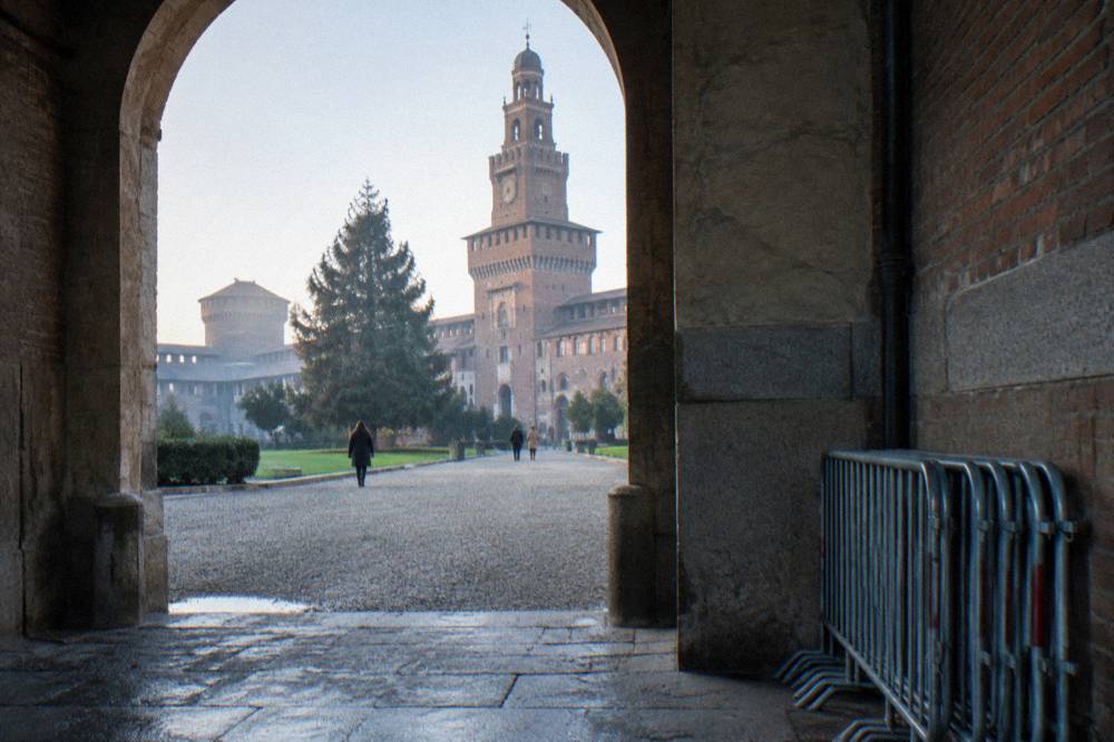 Castello Sforzesco courtyard with the Sforza castle tower above an open archway