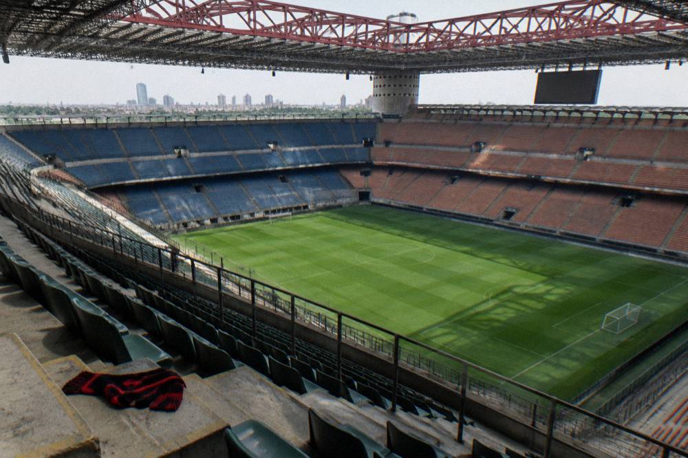 Wide view of the San Siro stadium stands and pitch seen from inside the seating bowl