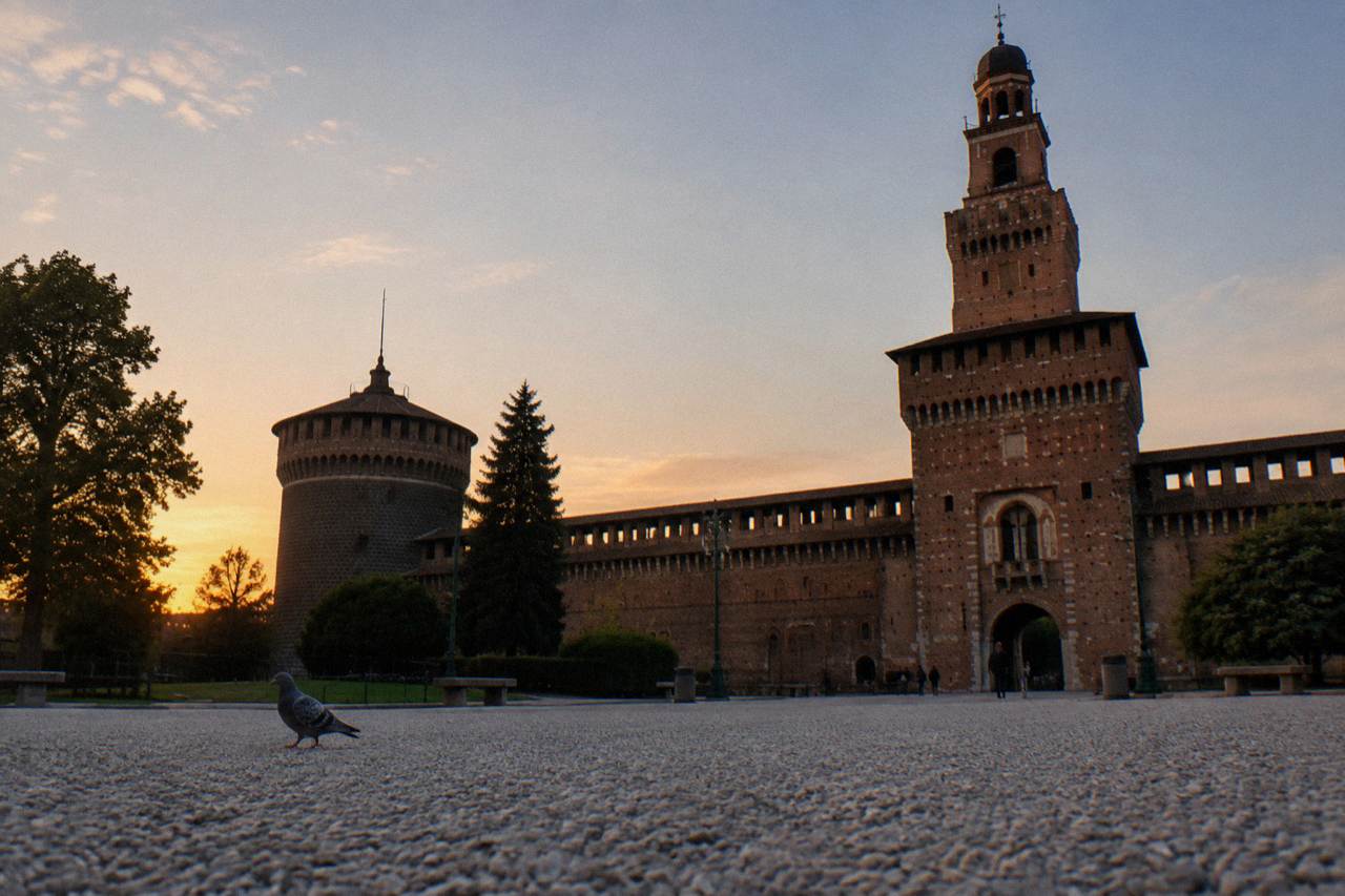 Sforza Castle stone gateway and courtyard under a wide evening sky