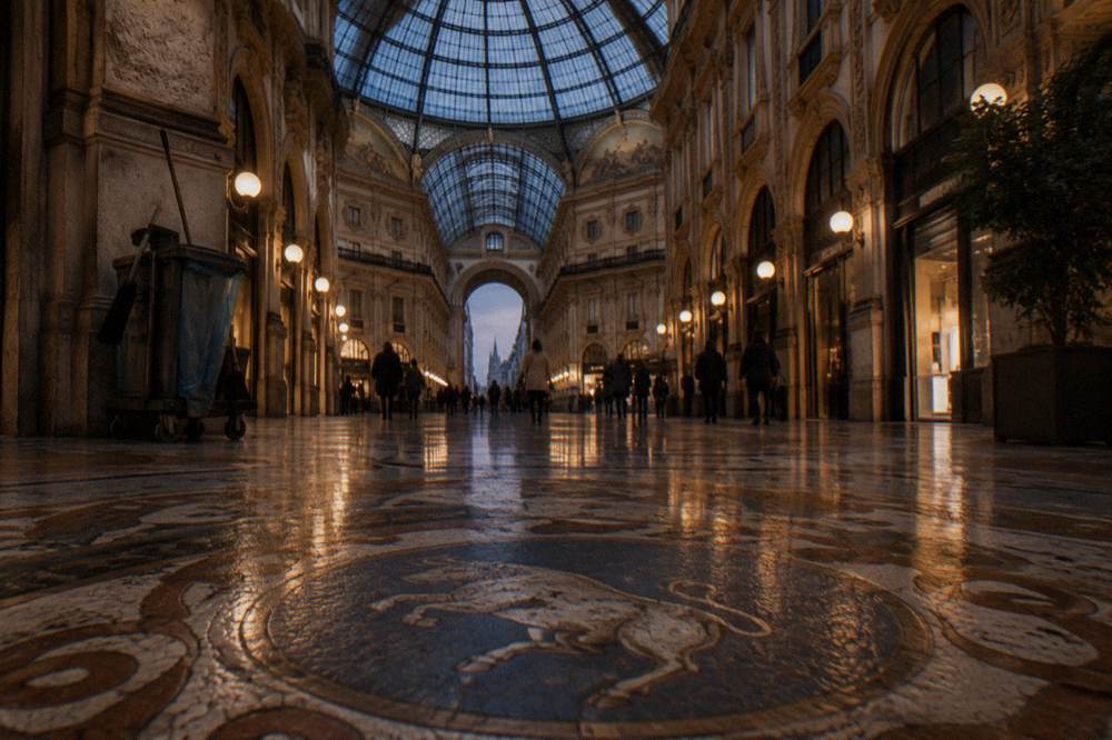 Interior of the Galleria Vittorio Emanuele II with its glass dome and mosaic floor seen from below