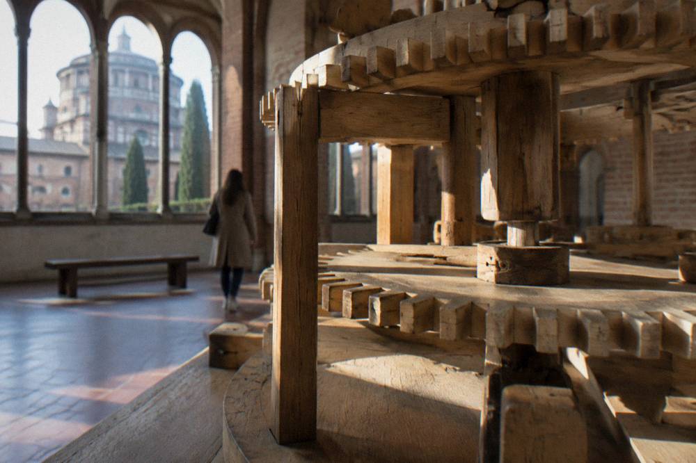 Wooden scale models of Leonardo da Vinci machine designs displayed in a gallery
