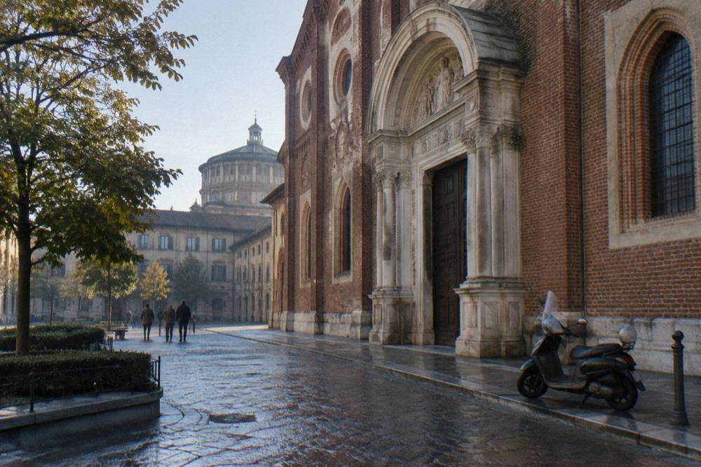 Renaissance church facade with a large arched doorway under a clear sky