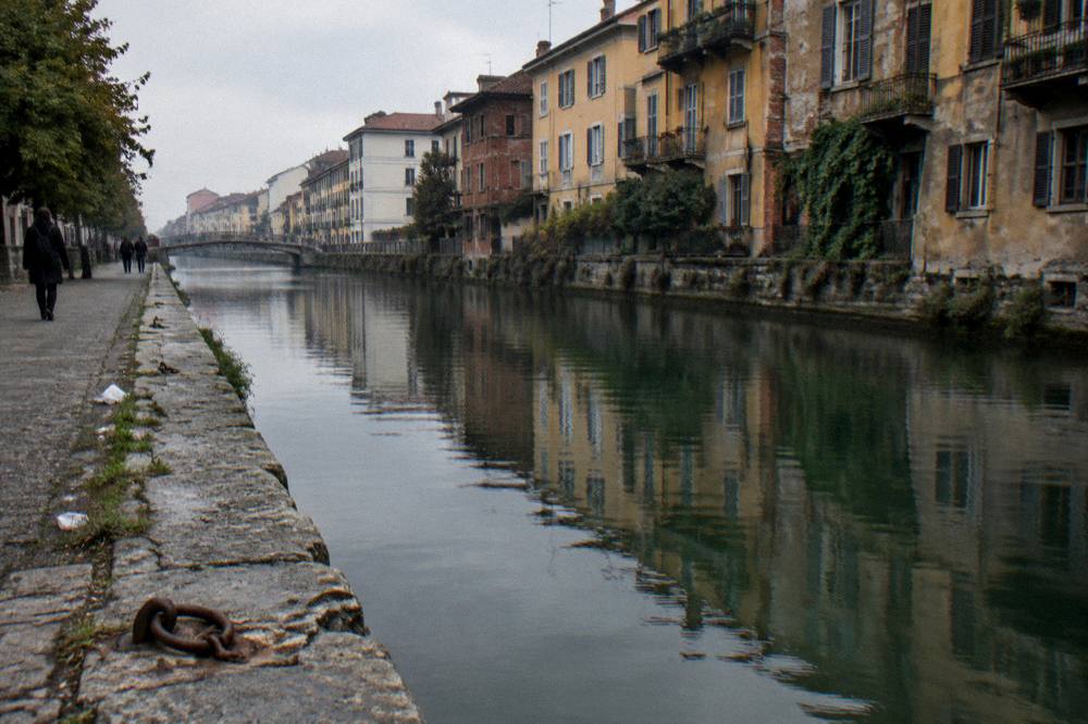 Naviglio Grande canal with stone banks and old buildings