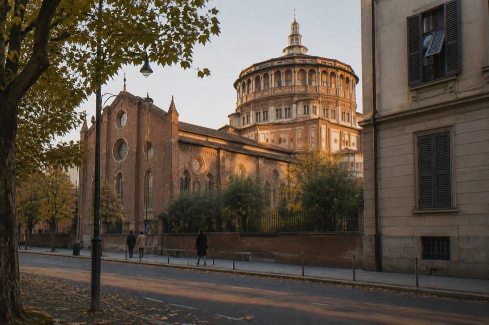 Exterior brick facade and church dome of Santa Maria delle Grazie in Milan